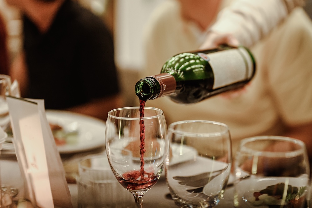 Wine being pured at fancy restaurant